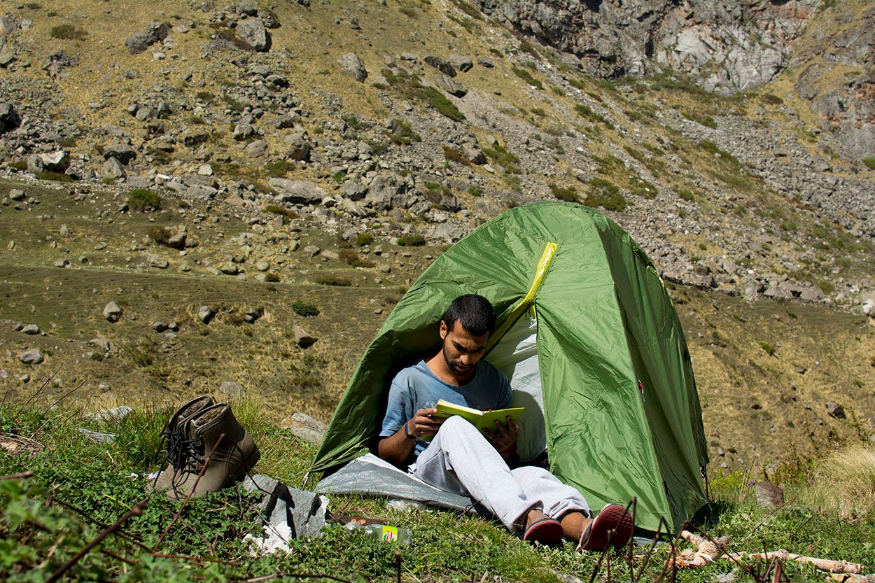 reading mountain quotes while camping